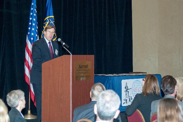 James Shields, president and chief executive officer of Draper Laboratory, addresses Fellowship Award winners at the chapter's event in May.